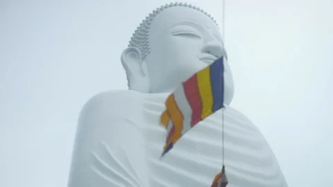 Close up of Buddha statue with flags in slow motion, Vietnam Stock Footage 137976609