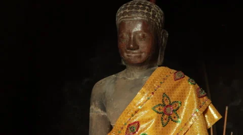Close-up of a Buddha statue with silk robe at the Bayon temple in Angkor Stock Footage 42461846