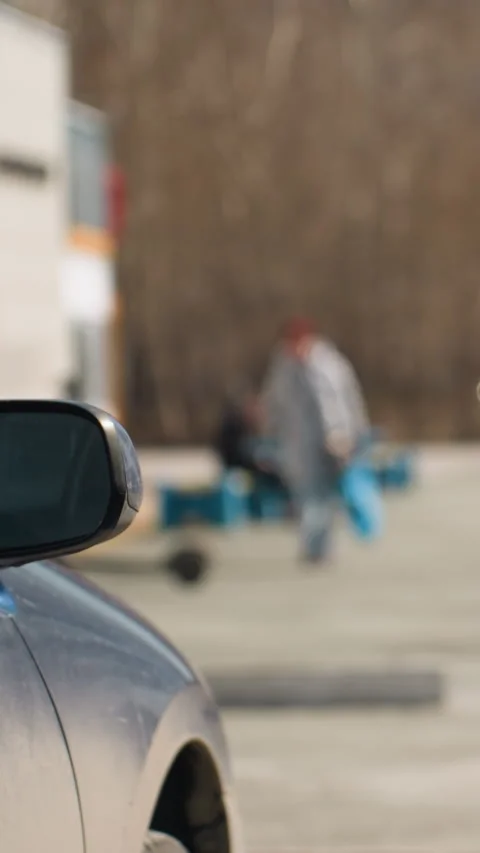 Close-Up of Budding Tree Branches in Urban Parking Lot with City Buildings Stock Footage 310335721