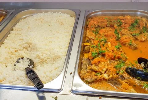 Close-up buffet with fish and pickled carrots and rice on the side Stock Photos