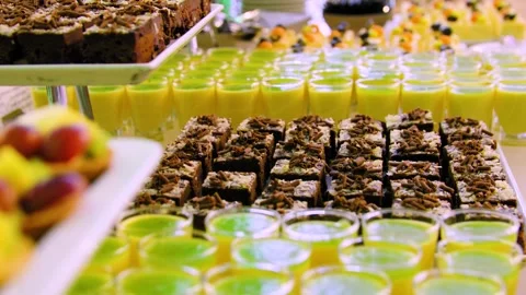 Close-up of a buffet table with sweet dishes in a restaurant. A dessert table. Stock Footage 300434193
