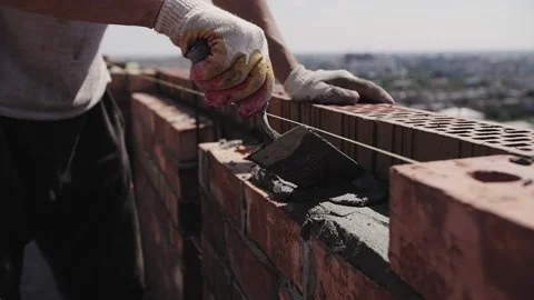 Close-up of the builder hands, bricklaying Stock Footage 217977394