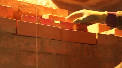 Close-Up The Builder Working With level and Bricks Stock Footage 123797972