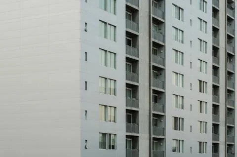 Close up to a building, pattern of windows of a gray building Stock Photos