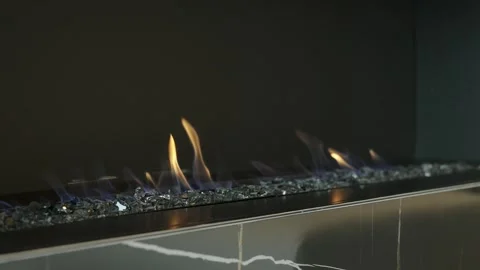 Close up of built into wall modern open fireplace burning with flames on ashes Stock Footage 265201484