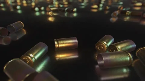 Close Up of Bullet Casings on Reflective Surface Stock Footage 60768173