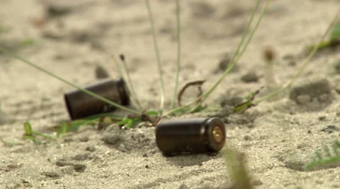 Close up of bullets falling to the ground 2 Stock Footage 43767921