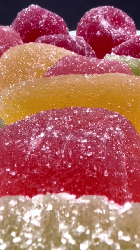 A close up of a bunch of different colored gummy bears Stock Footage 318122098