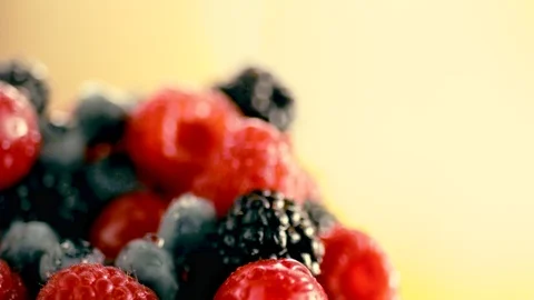 Close-up of bunch of fresh wild berries blueberries blackberries and raspberries Stock Footage 114738987