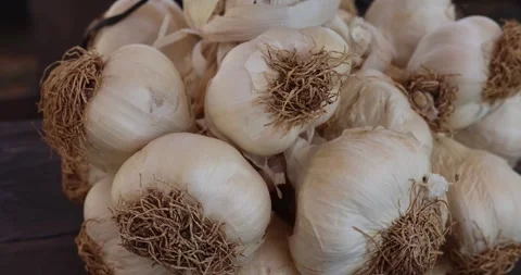Close-up a bunch of garlic along with plant roots. Stock Footage 264874522