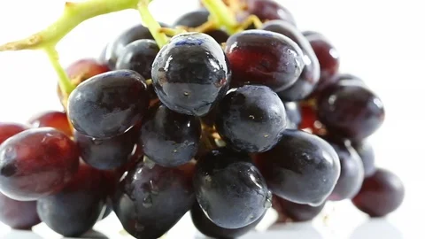 A close up of a bunch of grapes rotating on a turntable Stock Footage 87857067