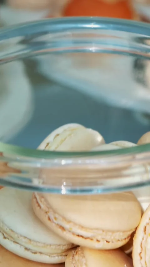 A close up of a bunch of macaroons in a glass jar Stock Footage 317315762