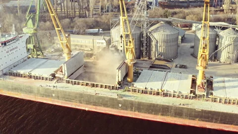 Close up Bunkering of dry cargo ship with grain in sea port with harbor crane Stock Footage 236373283