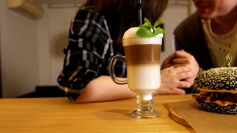 Close up burger and coffee on the table Stock Footage 76165584