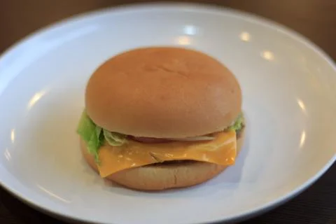 Close-up burger, burger select focus on a white plate lowl ight or underexpos Stock Photos