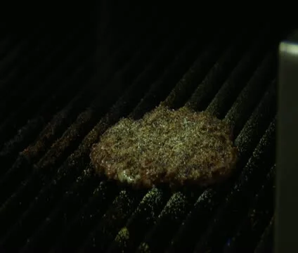 Close-up on Burger cooking with flame Stock Footage 21586397
