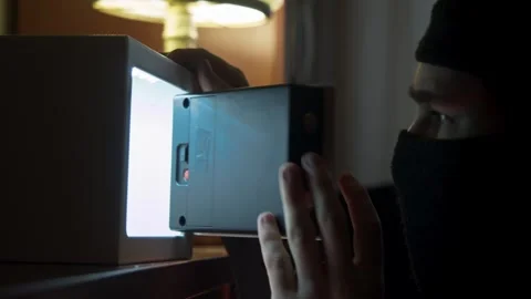 Close up of burglar gloved hands tapping code, opening safe and hurriedly Stock Footage 323535249