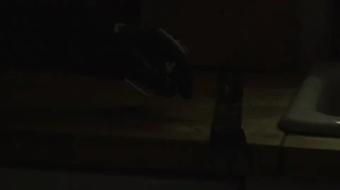 Close up of burglar's hand taking a cellphone Stock Footage 44103170