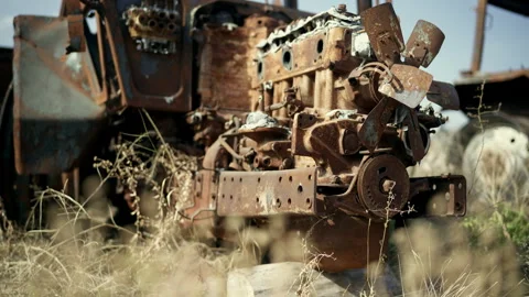 Close-Up of Burned Tractor Engine Rusting in Junkyard Stock Footage 305310767