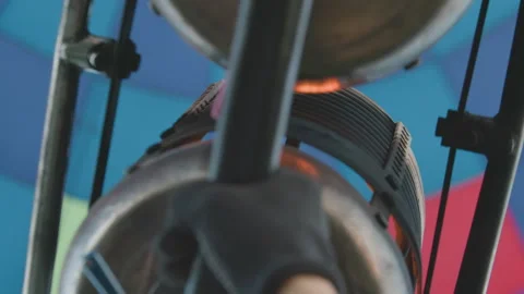 Close up of burner flame igniting hot air balloon envelope Stock Footage 317157955