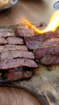 Up close burning beef meat Stock Photos