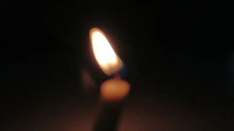 Close up of a burning candle in a dark place Stock Footage 285452719