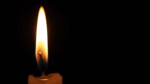 Close-up burning candle flame Stock Footage 93488248