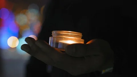 Close Up Burning Candle on Palm Stock Footage 101670000