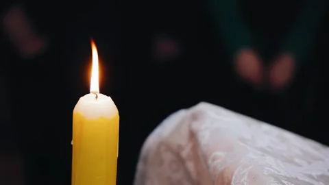 A close-up of a burning candle in a temple Stock Footage 335103539