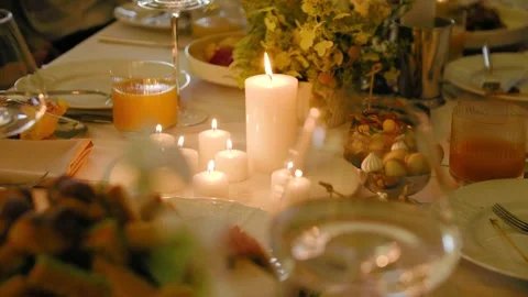 Close-up of burning candles standing on a wedding dinner table with tasty food. Stock Footage 288106871