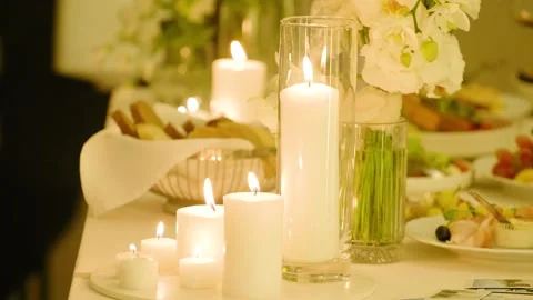 Close-up of burning candles standing on a wedding dinner table with tasty food. Stock-Footage 288107048