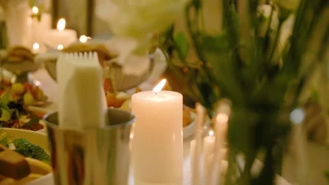 Close-up of burning candles standing on a wedding dinner table with tasty food. Stock-Footage 288107090