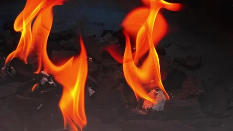 Close Up of Burning Charcoal and Orange Flames with Glowing Embers. 4K Slow.. Stock Footage 328985403