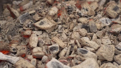 Close up of burning charcoal. Coal in the grill. Wind and rain Stock Footage 127978044