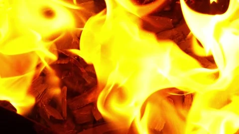 Close-Up Burning Coals and Flames Heating Metal Grill Surface, Slow Motion Stock Footage 319809544