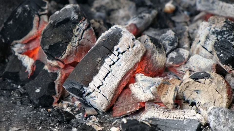Close-up of burning coals in the barbecue grill. Hot coal and flame with smoke. Vídeo Stock 126895596