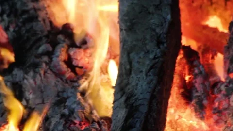 Close-up burning embers and flames - glowing charcoal fire, heat background Stock Footage 307020221