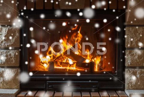 Close up of burning fireplace with snow Stock Photos