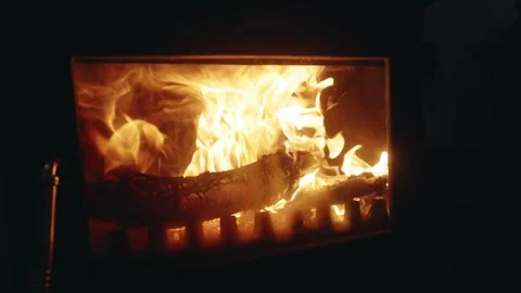 Close-up of Burning Firewood and Flickering Flames in a Fireplace Stock Footage 342341807