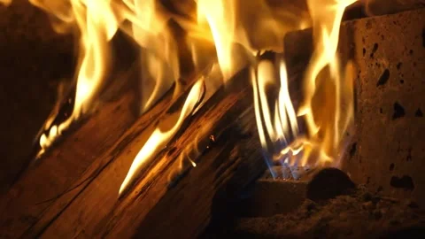 Close-up of burning firewood inside a traditional Italian brick pizza oven. Stock Footage 337678567