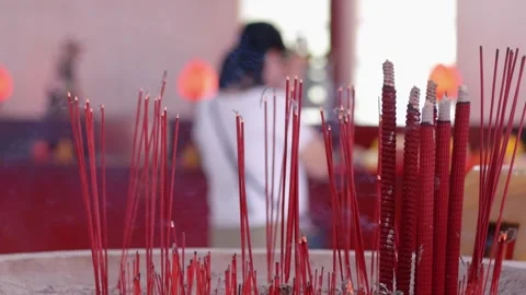 Close-up of Burning Incense Sticks in a Buddhist Temple Stock Footage 326304590