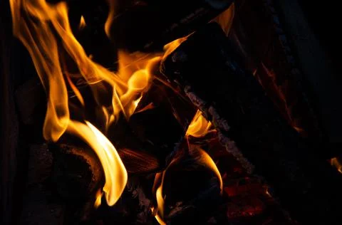 Close up burning logs in fire. Macro shooting of flames. Stock Photos