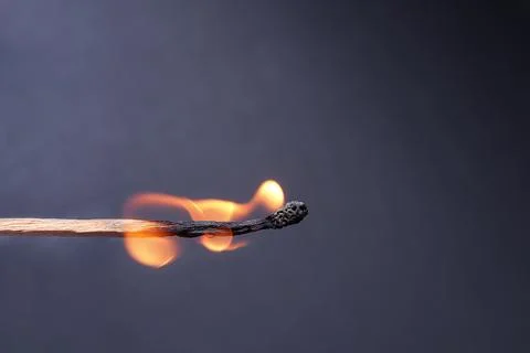 Close up of Burning match on dark background. burning,  Stock Photos