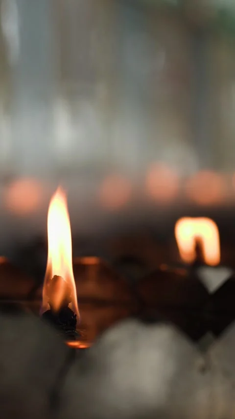 Close Up of Burning Oil Lamp Wicks in Buddhist Temple Stock Footage 340133989