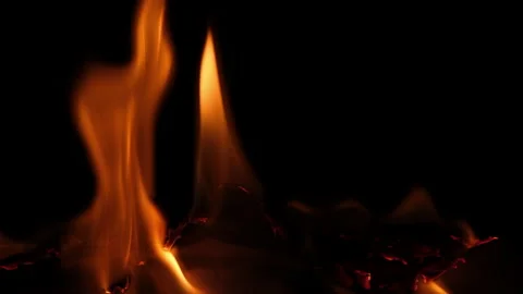 Close-up of burning paper with fire element isolated on black background. Stock Footage 232439579