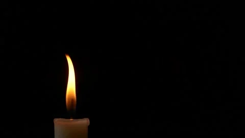 Close-up burning single candle flame isolated on black background, 4K video 스톡 동영상 170282334