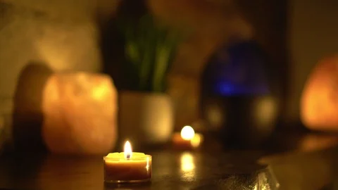 Close-up of burning tealight candle on table in home. Stock Footage 129299417