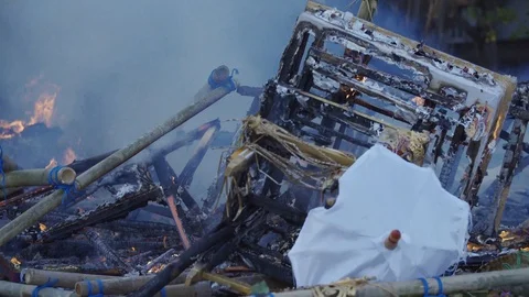 Close Up Burning Trash and Religious Monuments in Bali Environment Stock Footage 119904245