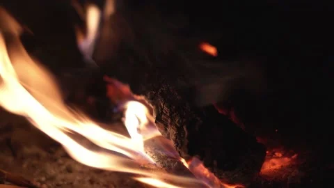 Close up of burning wood, flames in campfire, bonfire, 4K Stock Footage 133899554