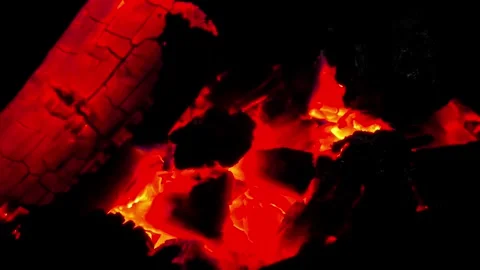 Close-up of burning wood producing a large flame. 4K Stock Footage 338433184
